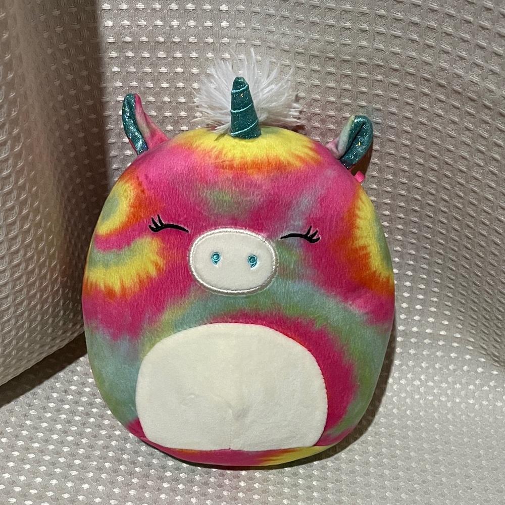 Shondie the tie-dye unicorn Squishmallow plush toy.